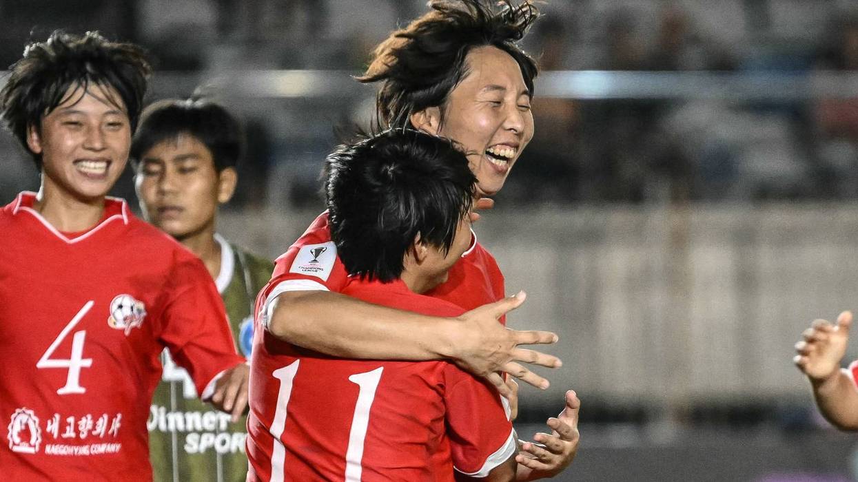 Ri Kum-Hyang (C, back) of Naegohyang Women's FC (PRK) celebrates with teammates