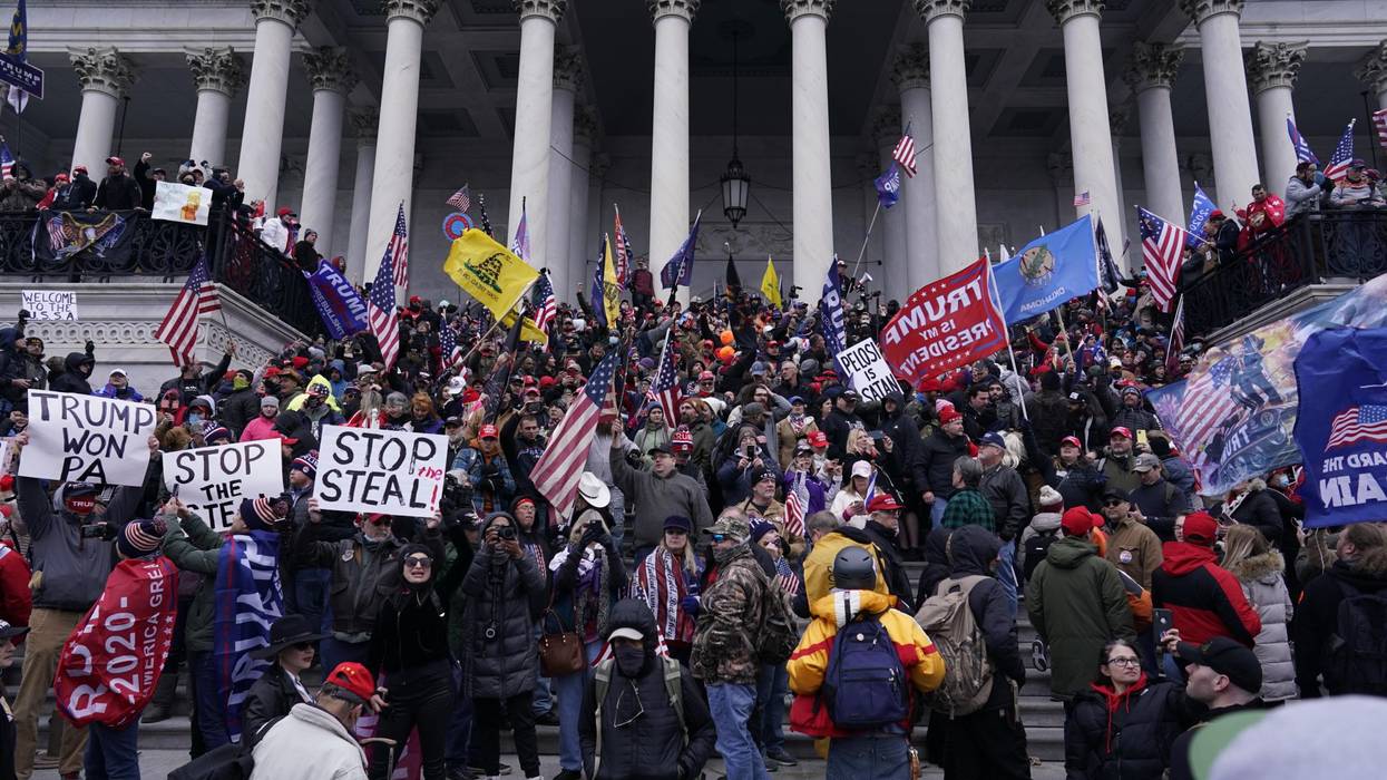 Right-wing insurrectionists, fueled by then-President Donald Trump's relentless lies about voter fraud, violently rioted at the U.S. Capitol in Washington, D.C., in an attempt to overturn the 2020 presidential election results before lawmakers finalized them in a joint session of the 117th Congress on January 6, 2021. (Photo: Kent Nishimura/Los Angeles Times via Getty Images)