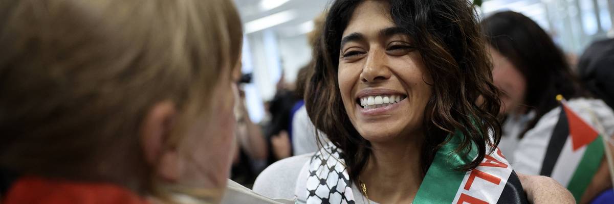 Rima Hassan is greeted by supporters upon returning to France after taking part in a Gaza Freedom Flotilla mission