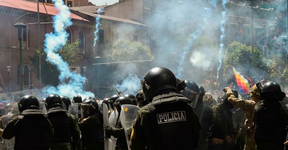 Riot police repress supporters of former Bolivian President Evo Morales during the funeral procession in La Paz, Bolivia on November 21, 2019. (Photo: Aizar Raldes/AFP via Getty Images)
