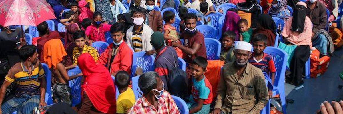 Rohingya refugees board a Bangladesh Navy ship