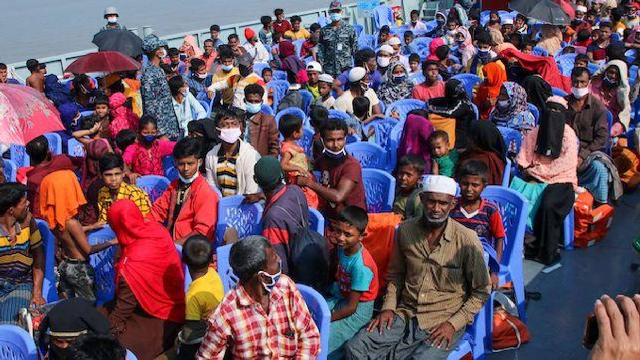 Rohingya refugees board a Bangladesh Navy ship
