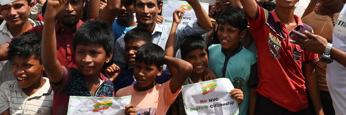 Rohingya refugees shout slogans during a "Genocide Remembrance Day" rally