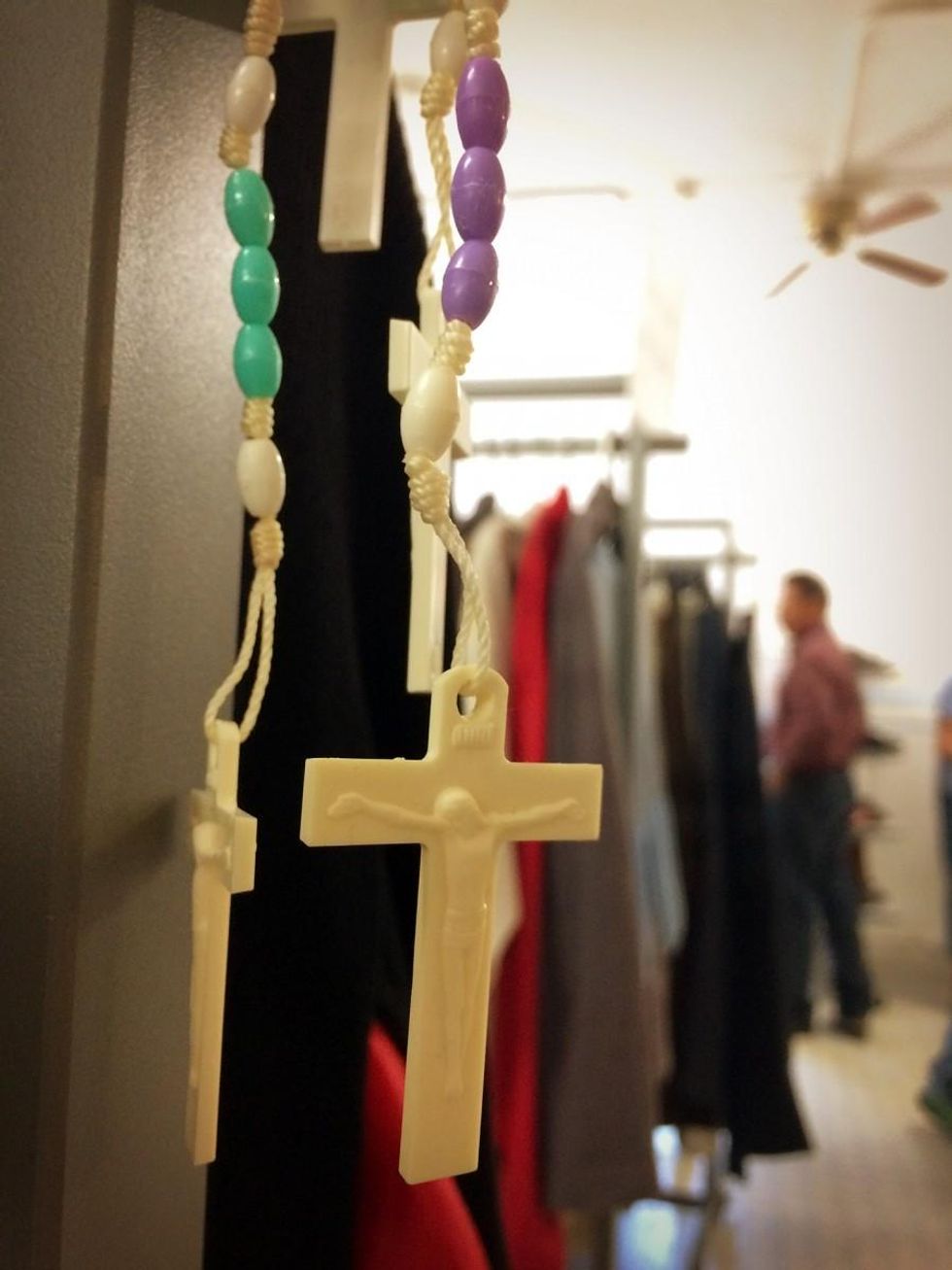 Rosaries are free for the taking in the clothing room, where asylum-seekers browse for well-fitting clothes. (Photo: Rose Lambert-Sluder)