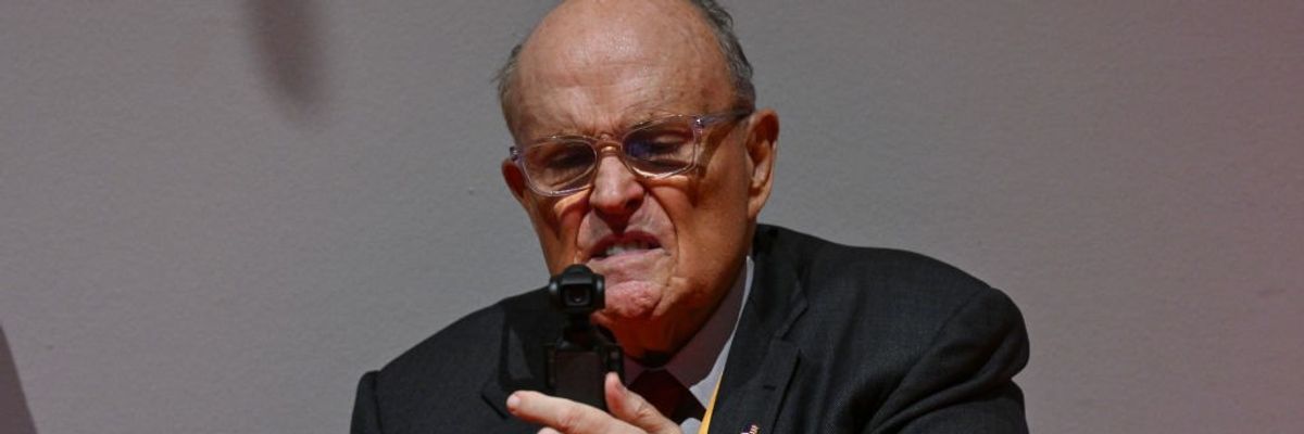 Rudy Giuliani records himself with a strange look on his face