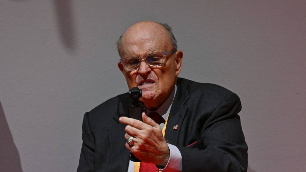 Rudy Giuliani records himself with a strange look on his face