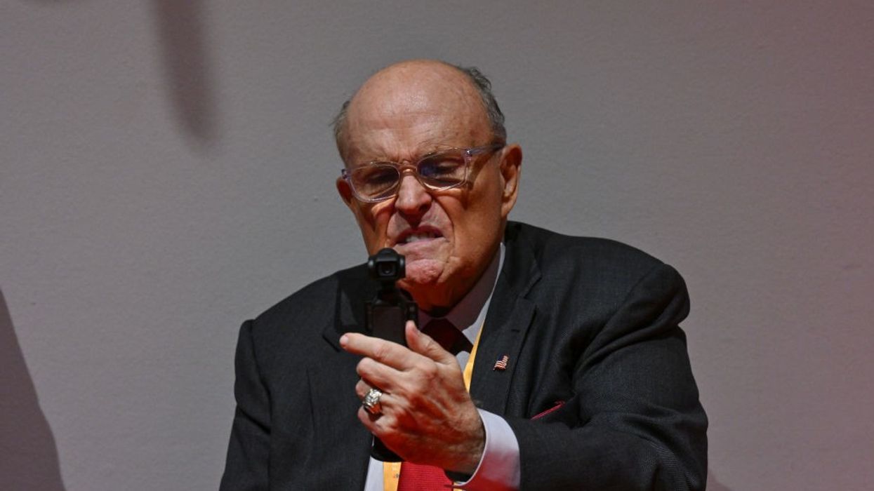 Rudy Giuliani records himself with a strange look on his face