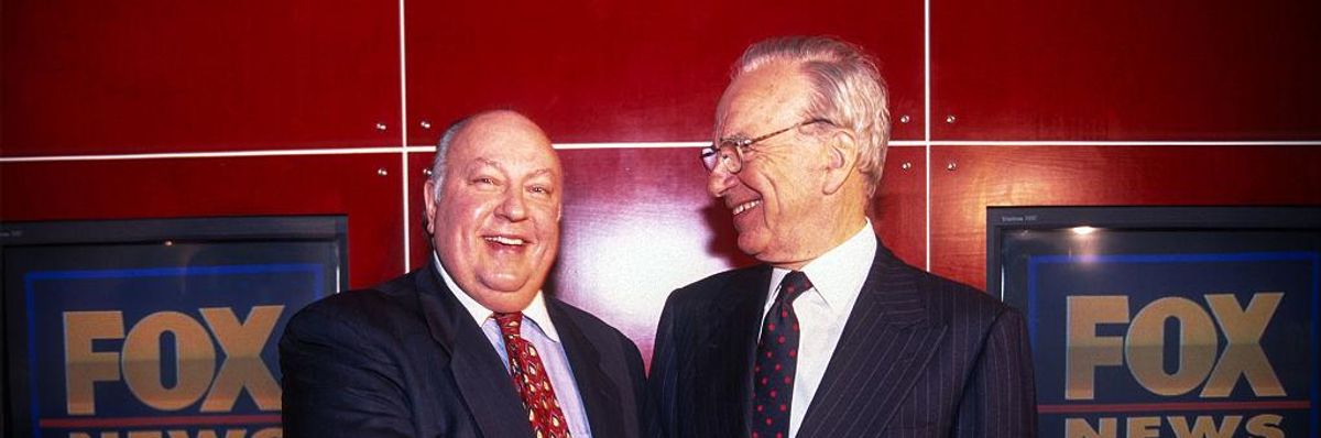 Rupert Murdoch shakes hands with Roger Ailes after naming Ailes the head of Fox News, New York, New York, January 30, 1996