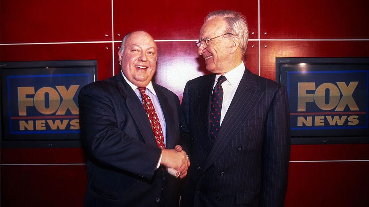 Rupert Murdoch shakes hands with Roger Ailes after naming Ailes the head of Fox News, New York, New York, January 30, 1996