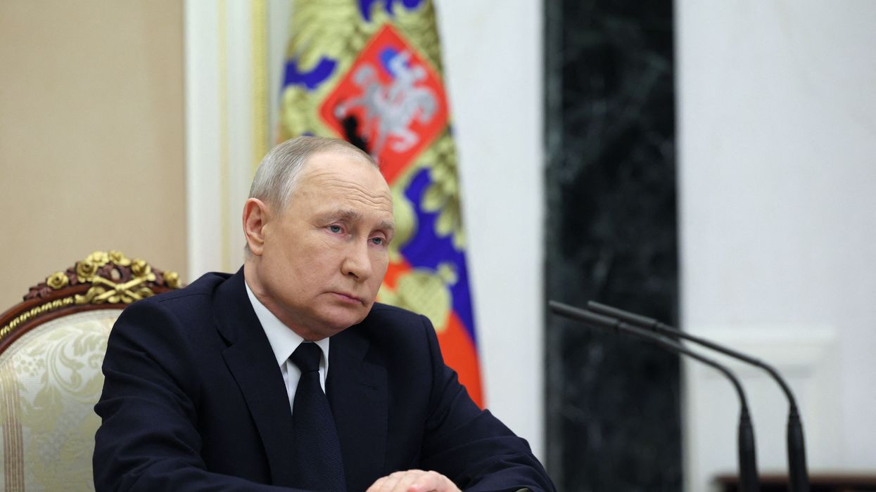 Russian President Vladimir Putin attends a meeting at the Kremlin in Moscow on March 25, 2023.