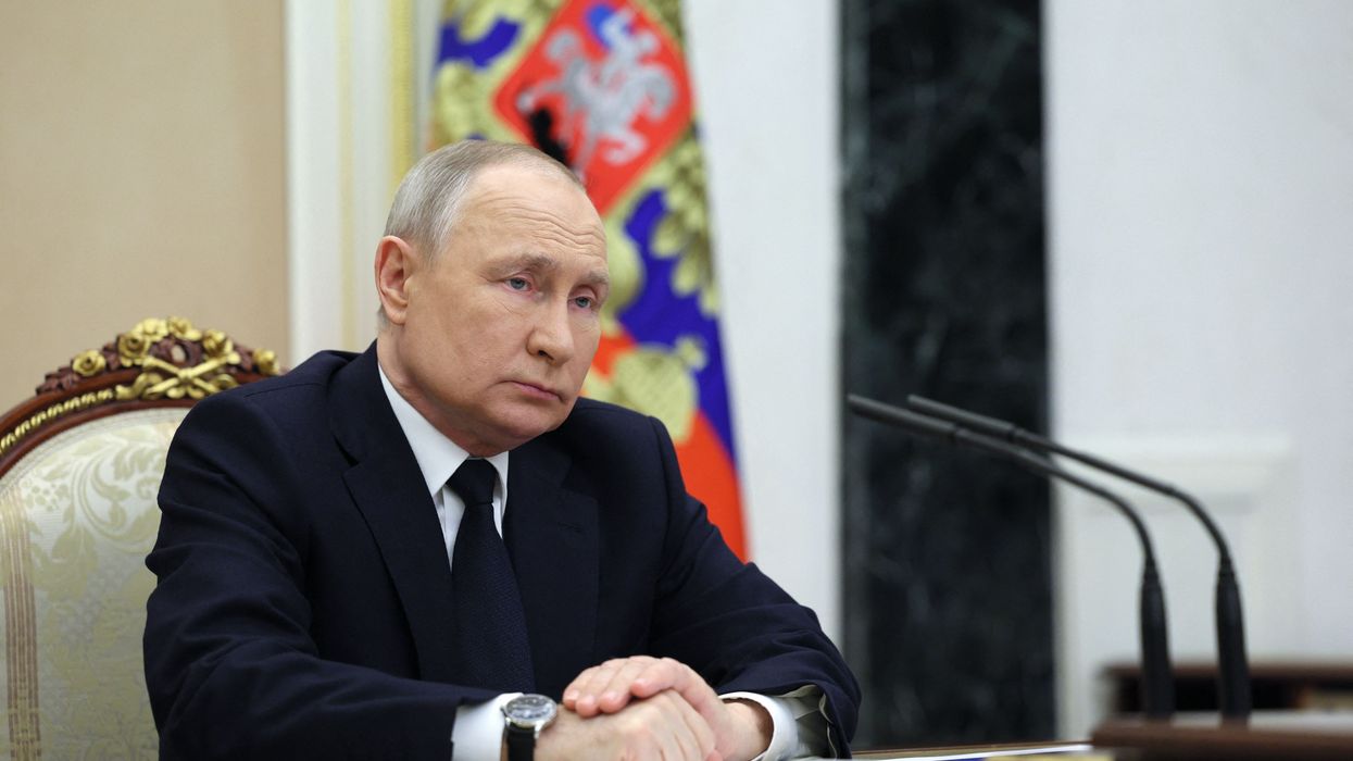Russian President Vladimir Putin attends a meeting at the Kremlin in Moscow on March 25, 2023.