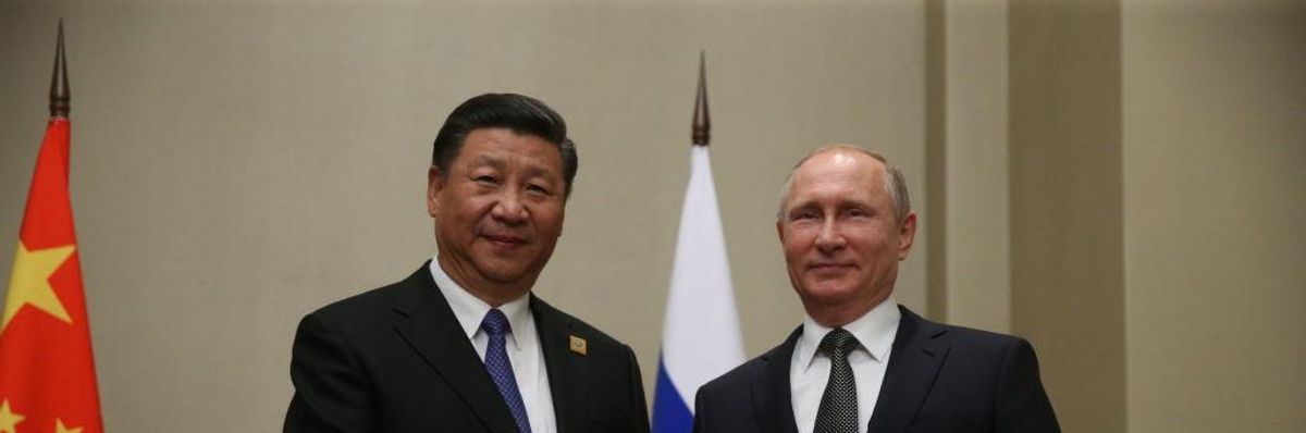 Russian President Vladimir Putin meets Chinese President Xi Jinping in Astana