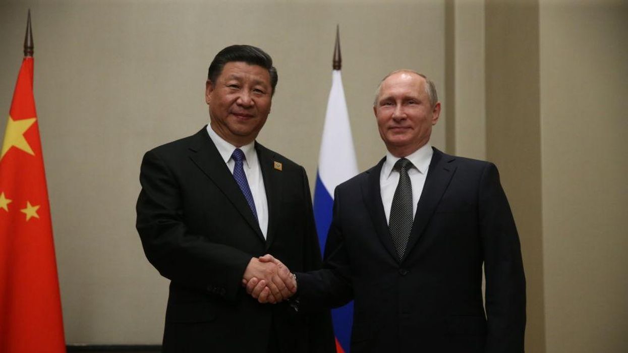 Russian President Vladimir Putin meets Chinese President Xi Jinping in Astana