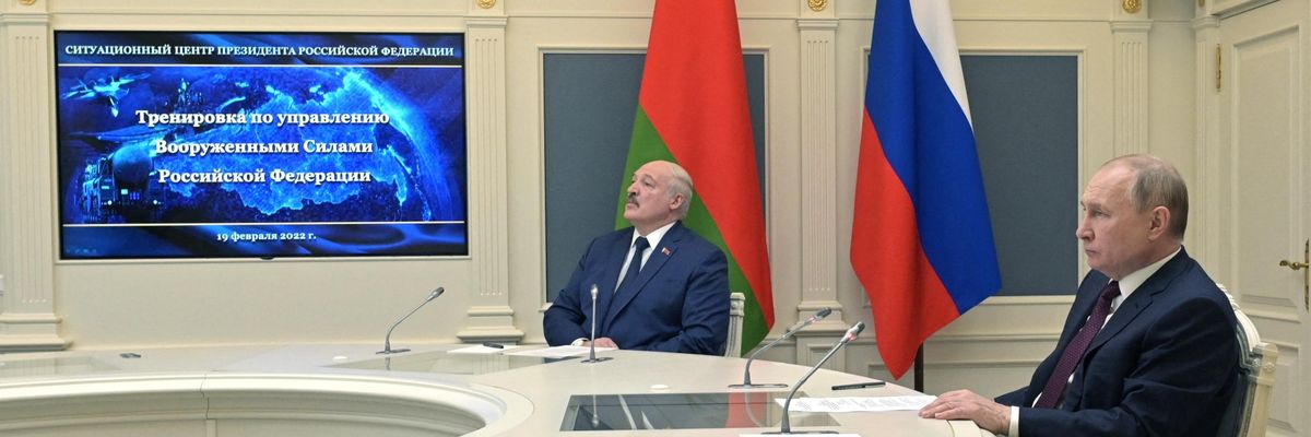 Russian President Vladimir Putin (R) and his Belarusian counterpart Alexander Lukashenko (L) watch training launches of ballistic missiles as part of the Grom-2022 Strategic Deterrence Force exercise, from the situational centre of the Russian Defense Ministry in Moscow on February 19, 2022.