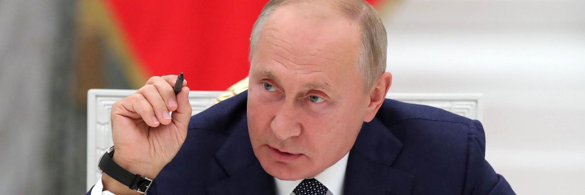 Russian President Vladimir Putin speaks with nuclear industry workers during a meeting on September 23, 2020 to mark the 75th anniversary of the country's nuclear industry at the Kremlin in Moscow.