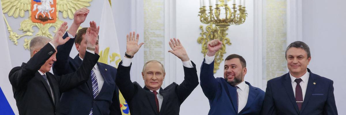 Russian President Vladimir Putin surrounded by other Kremlin officials and leaders of Donbas separatist groups