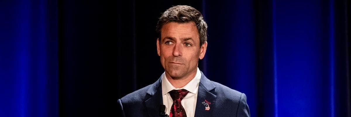 Ryan Kelley, a Michigan gubernatorial candidate, speaks on a debate stage