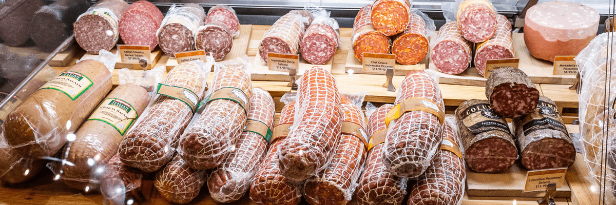 salumi and other deli meats behind a counter