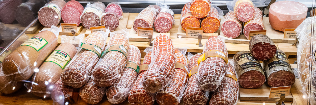 salumi and other deli meats behind a counter