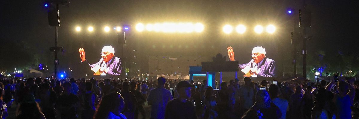 Sanders is shown on a two screens at Coachella.