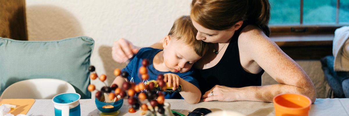 Sara Dean and her 2-year-old son, Patrick, sit at a table in their Parchment, Michigan home on October 8, 2018--a few months after it was discovered that the community's drinking water was contaminated with high levels of PFAS.
