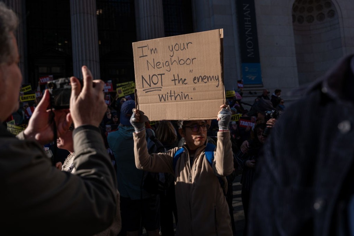 Says says "I'm your neighbor, not the "enemy within."