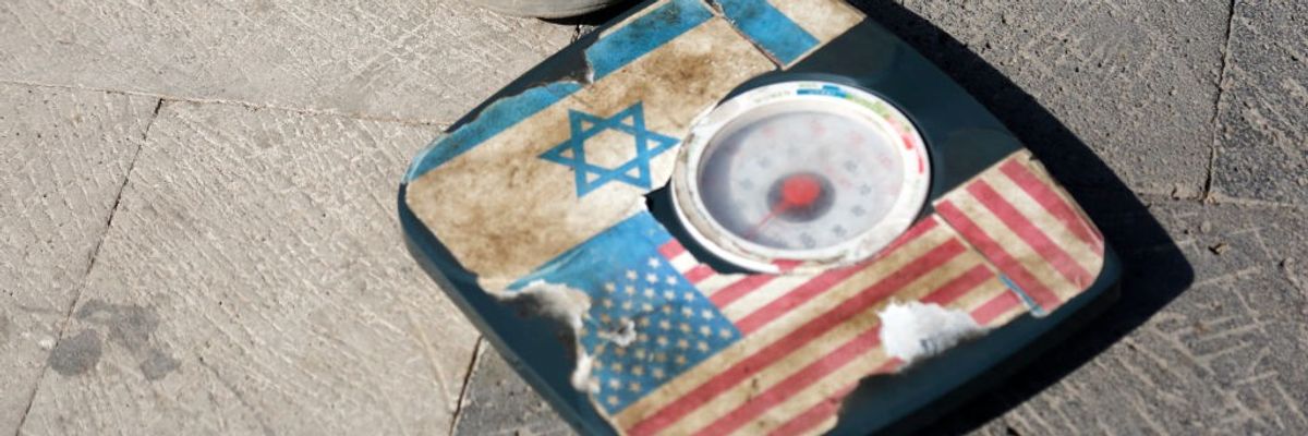 Scale in Yemen with Israeli and American flags for people to step on.