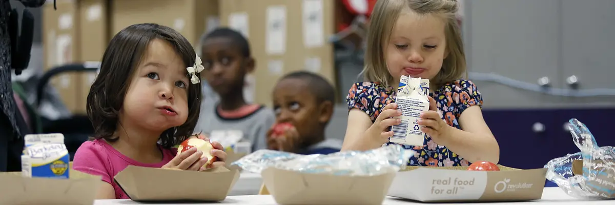 School children have lunch in a library in San Francisco, California