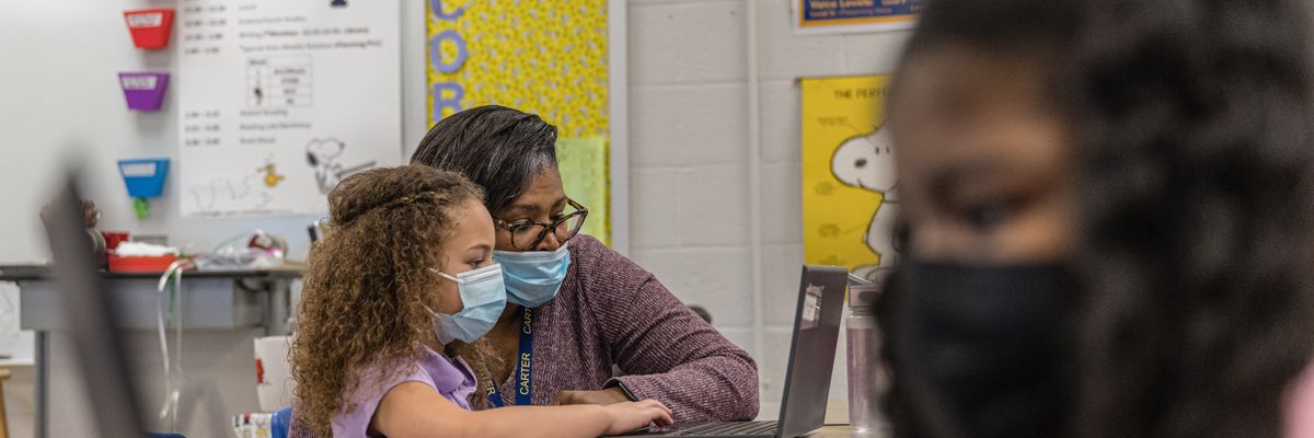 School teacher teaching student
