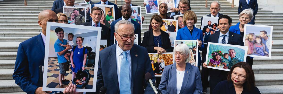 Schumer holds up photo of Kate Farley