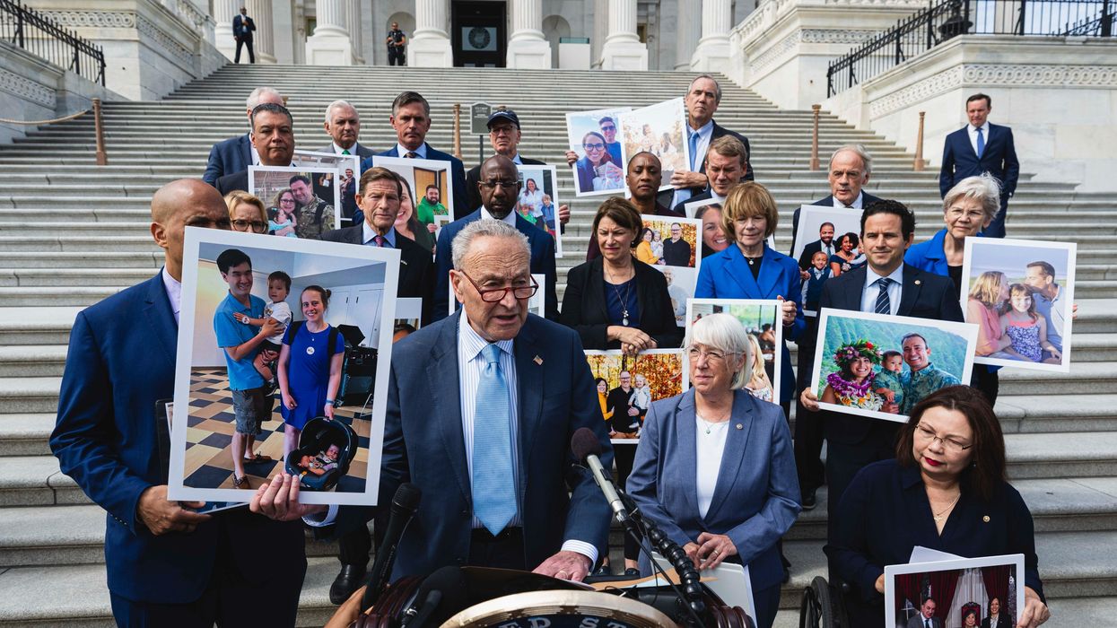 Schumer holds up photo of Kate Farley
