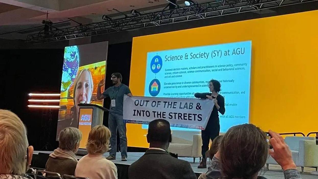 Scientists Peter Kalmus and Rose Abramoff took the stage for a brief protest