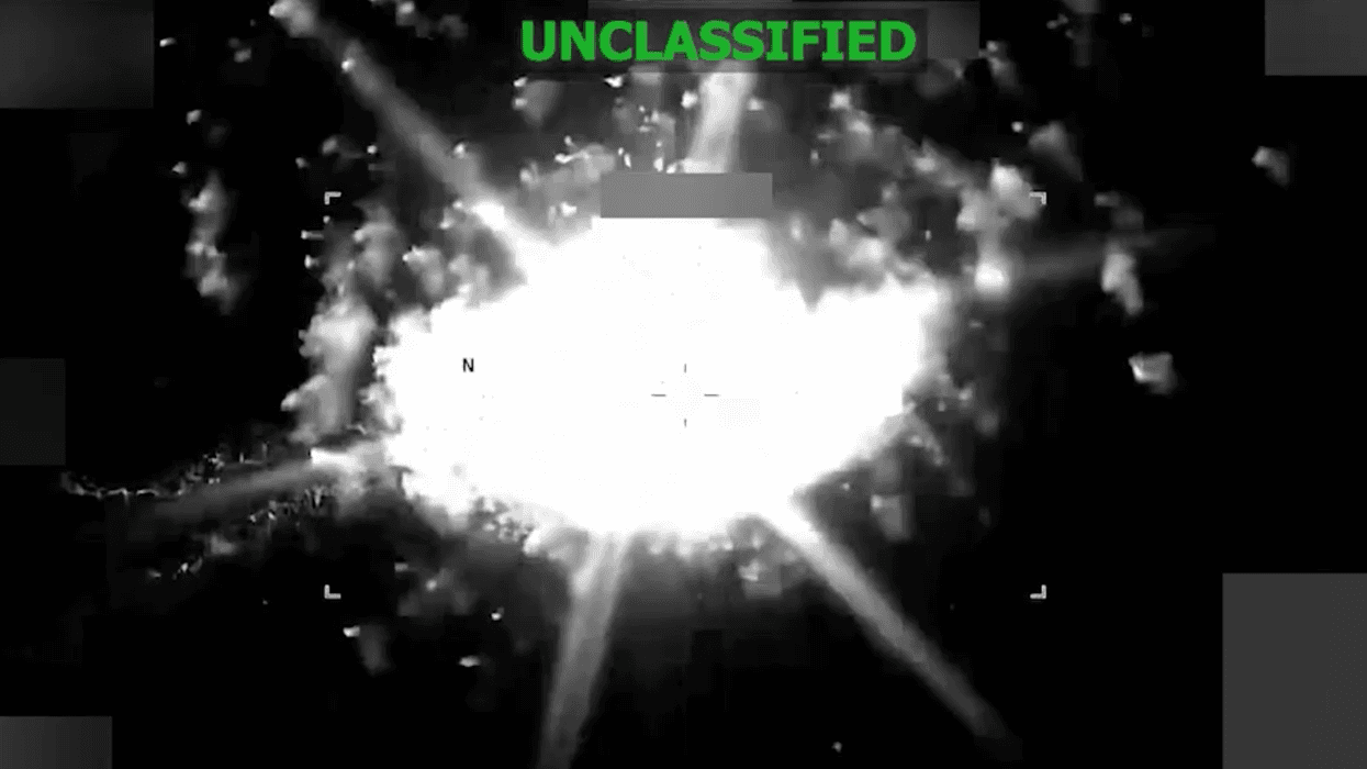 Screen shot of US military footage marked "unclassified" of a boat strike