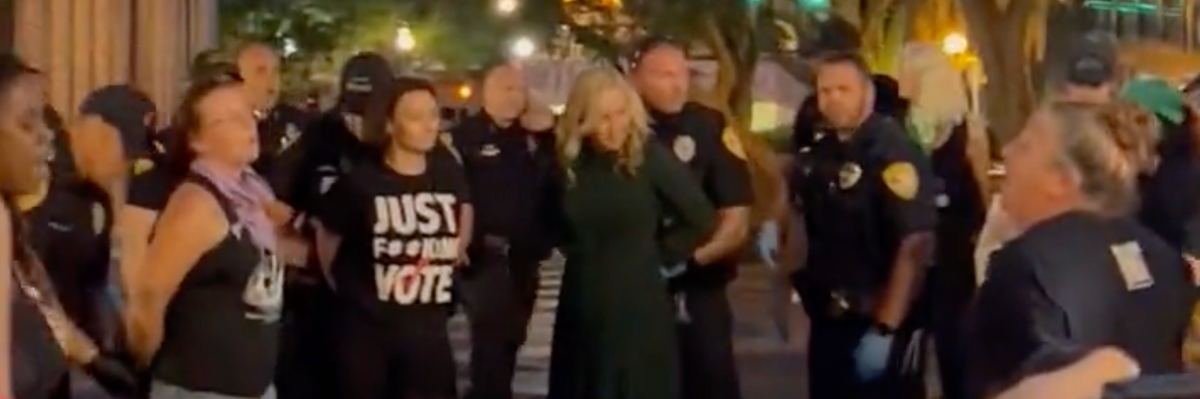  screengrab of video footage shows protesters, including two Florida Democratic leaders, being arrested