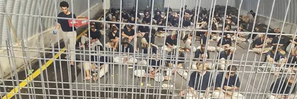 Sde Teiman prisoners sit shackled and blindfolded