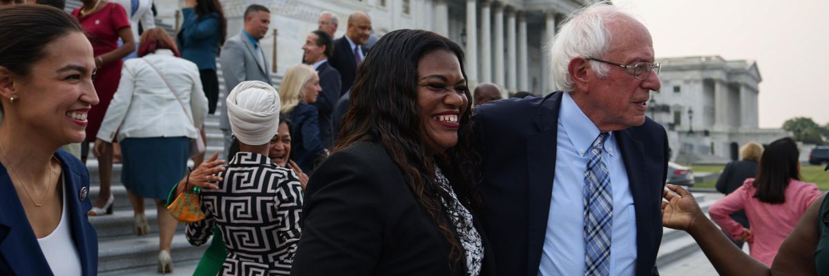 Sen. Bernie Sanders (I-Vt.) greets Rep. Cori Bush (D-Mo.) during a group photo