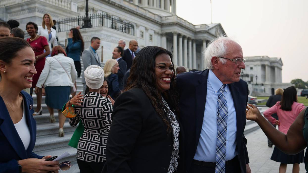 Sen. Bernie Sanders (I-Vt.) greets Rep. Cori Bush (D-Mo.) during a group photo