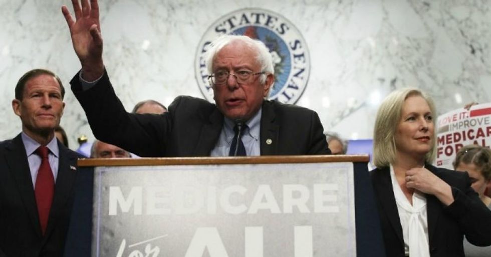 Sen. Bernie Sanders (I-Vt.) speaks on healthcare as Sen. Richard Blumenthal (D-Conn.) and Sen. Kirsten Gillibrand (D-N.Y.) listen during an event September 13, 2017 on Capitol Hill in Washington, D.C. (Photo: Alex Wong/Getty Images)