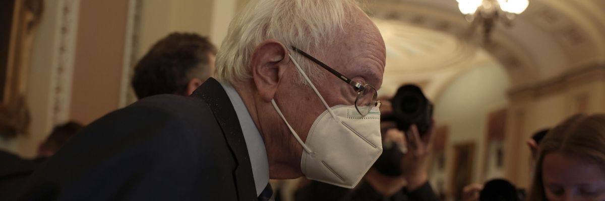 Sen. Bernie Sanders (I-Vt.) speaks to reporters as he leaves a caucus meeting with Senate Democrats at the U.S. Capitol Building on December 16, 2021 in Washington, D.C.