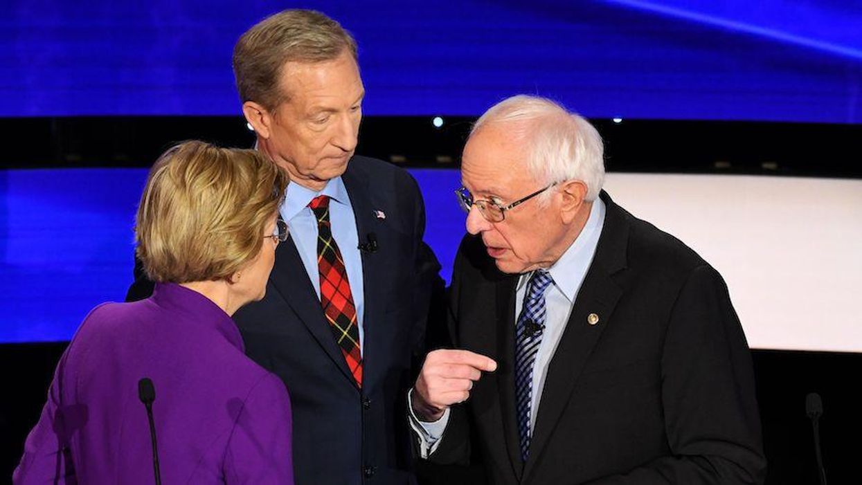 Sen. Elizabeth Warren (D-Mass.) chats with Sen. Bernie Sanders (I-Vt.) alongside billionaire-philanthropist Tom Steyer