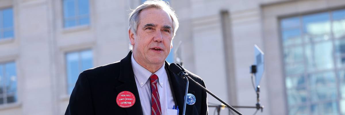 Sen. Jeff Merkley at a podium.
