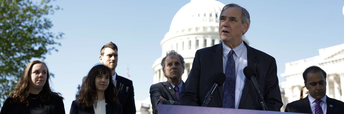 Sen. Jeff Merkley speaks at a press conference on the introduction of the ETHICS Act