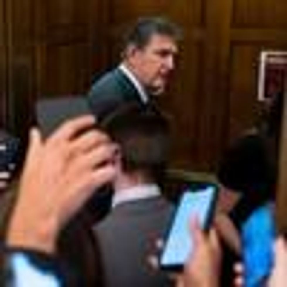Sen. Joe Manchin enters an elevator