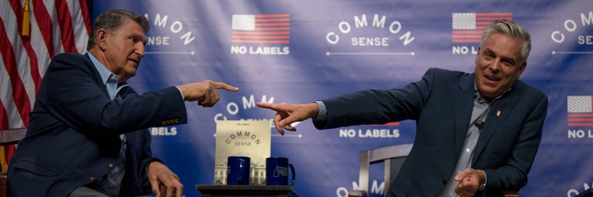 Sen. Joe Manchin III (D-W.Va.) and former Utah governor Jon Huntsman (R) point at each other.