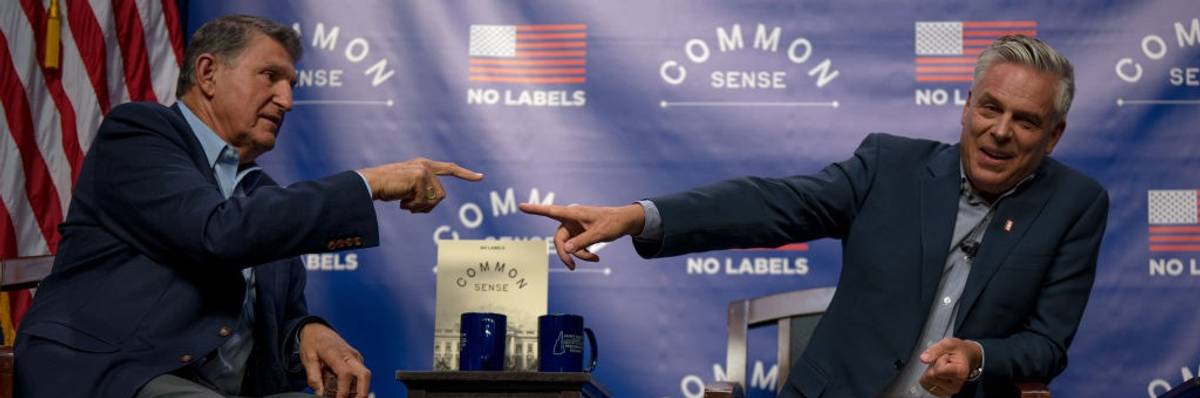 Sen. Joe Manchin III (D-W.Va.) and former Utah governor Jon Huntsman (R) point at each other.