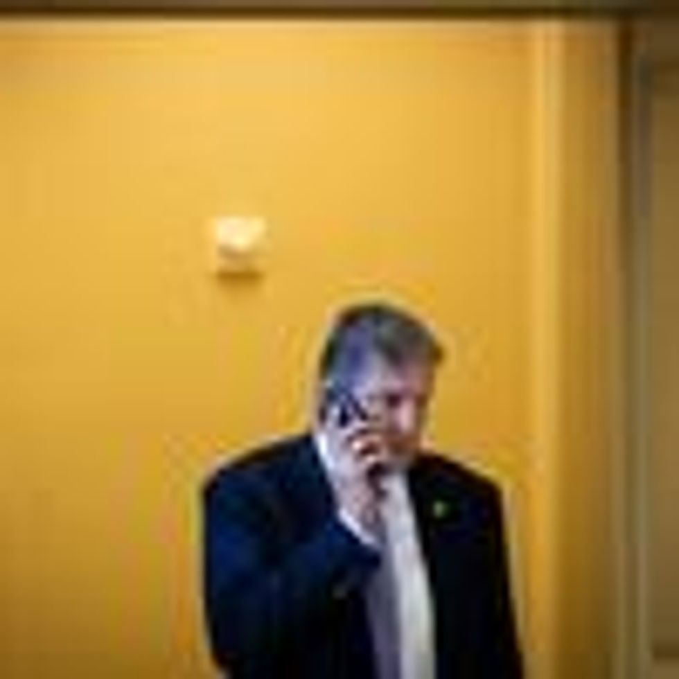 Sen. Joe Manchin speaks on the phone on Capitol Hill