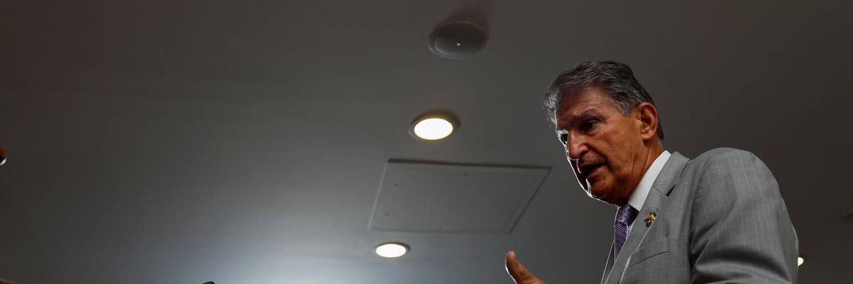Sen. Joe Manchin speaks to reporters outside of his office in Washington, D.C.