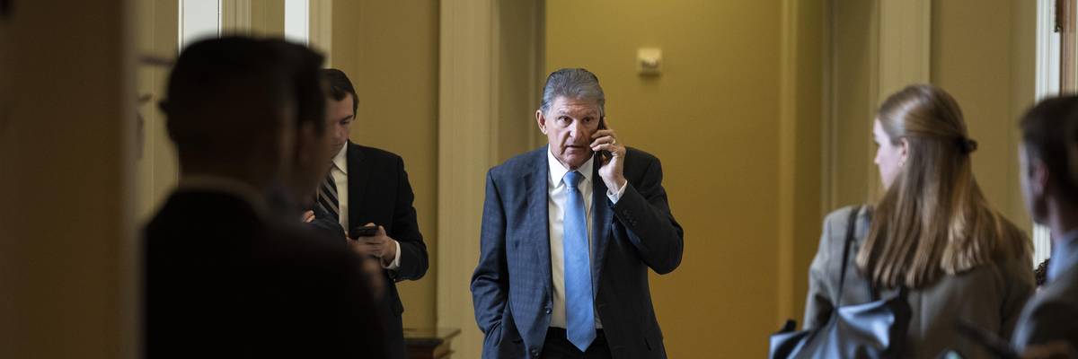 Sen. Joe Manchin talks on the phone