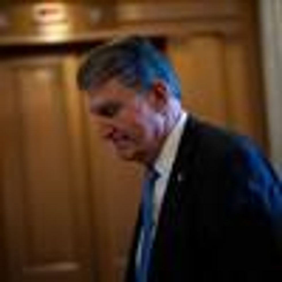 Sen. Joe Manchin walks in the Capitol hallway