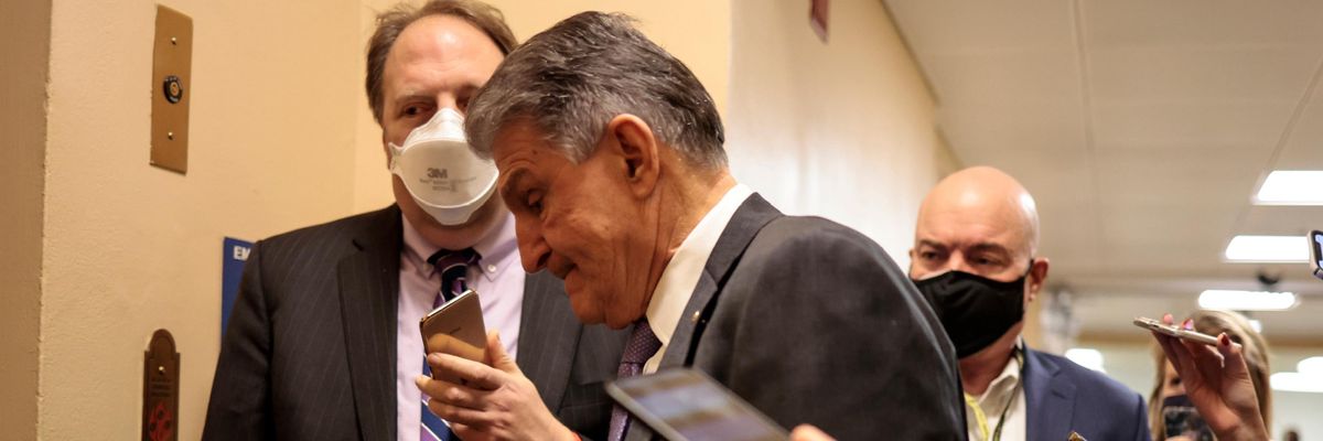 Sen. Joe Manchin walks through the halls of Congress
